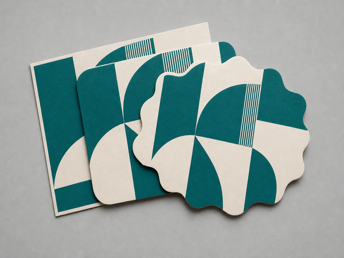 Die-cut label shapes in teal stacked so their differing outlines are visible