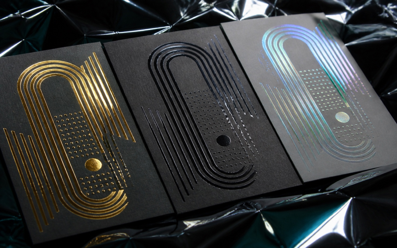 Raking light detail of foil stamping, spot UV and holographic finishes on one label design